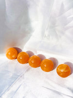 Load image into Gallery viewer, Small orange calcite sphere - Intuitively selected
