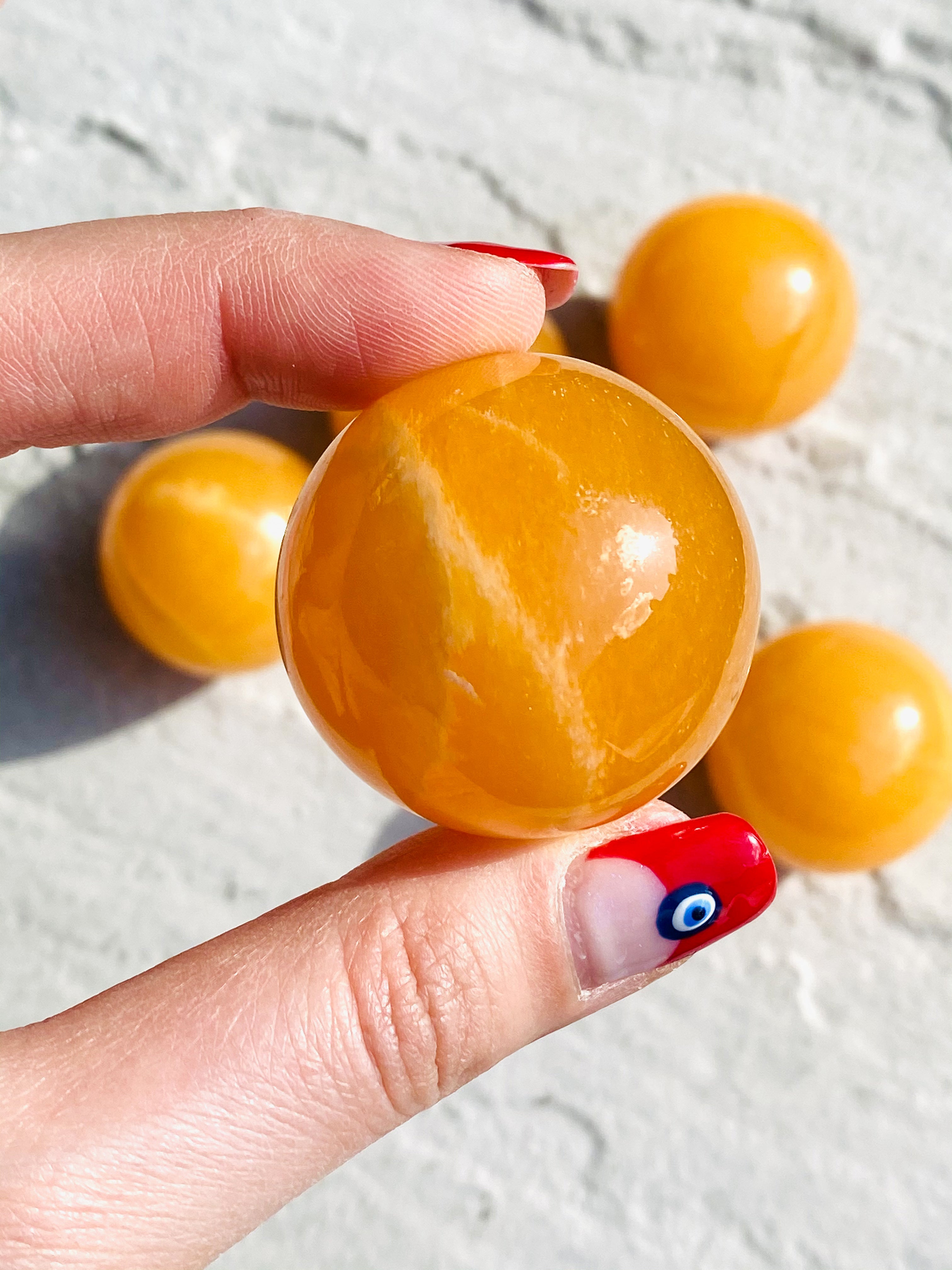 Small orange calcite sphere - Intuitively selected