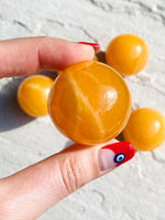 Load image into Gallery viewer, Small orange calcite sphere - Intuitively selected
