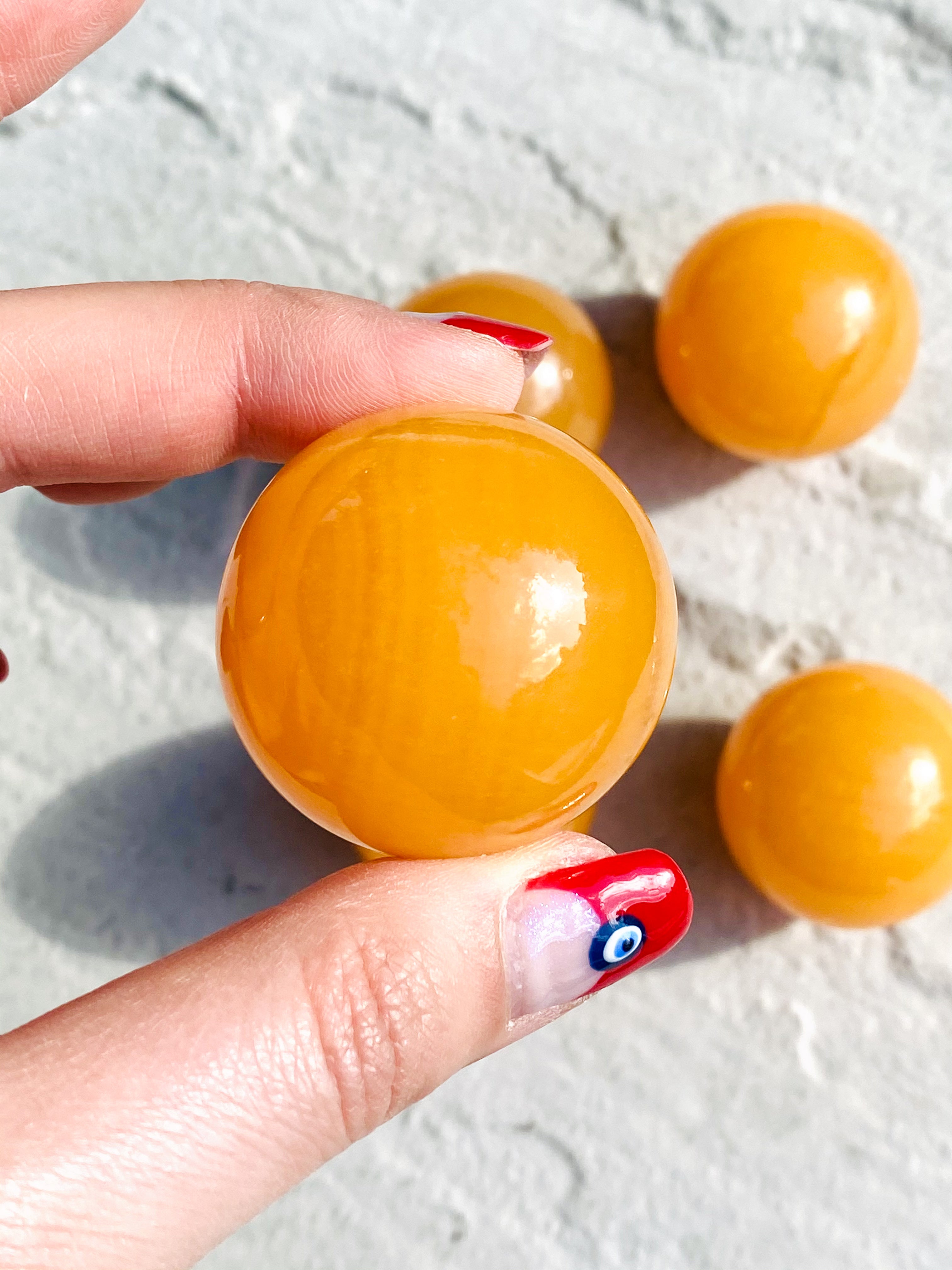 Small orange calcite sphere - Intuitively selected