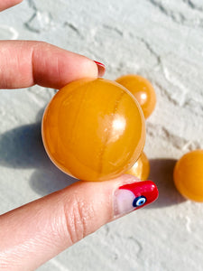 Small orange calcite sphere - Intuitively selected